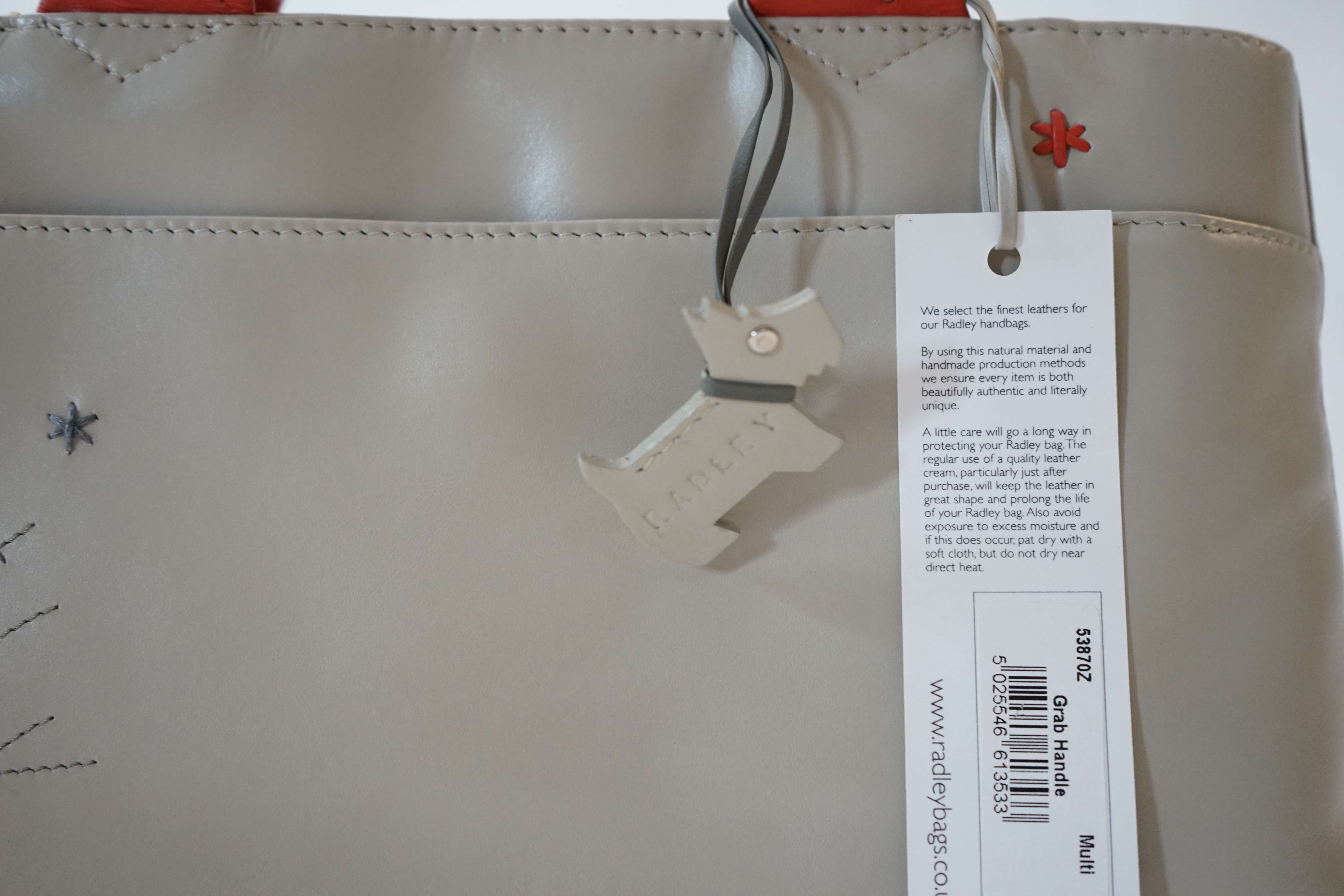 A Radley 'Seasons Greeting Reindeer Christmas' leather grab handle bag 2005, width 30cm, depth 8cm, height 16cm